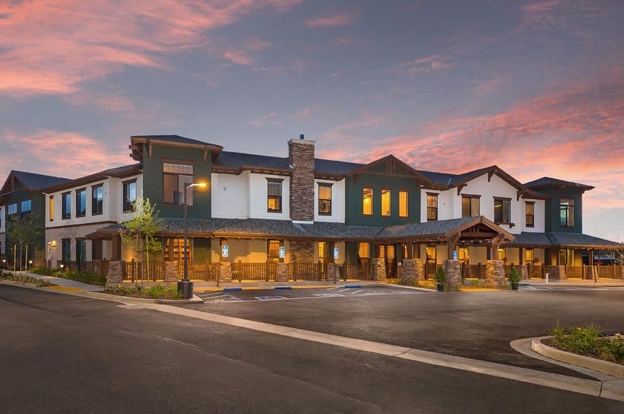 Exterior view of Westmont of Morgan Hill building at sunset